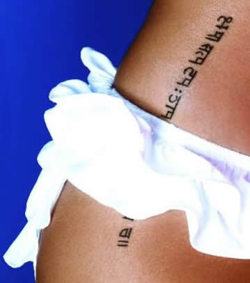 Here's an example picture of Rihanna's tattoo. star tattoo in her ear