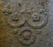 The Three Jewels detail from a Buddha's Footprint carving