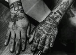 Hands show many Russian prison tattoos
