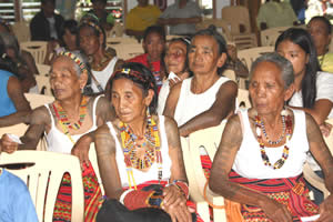 Tattooed elders look on at the Batok Festival. Whang Od sits at far right. Photograph courtesy of Chico River Quest.com.