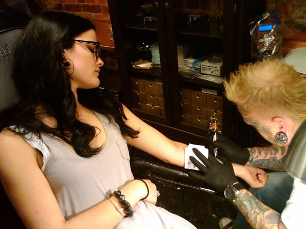 Jaimie Alexander getting tattooed