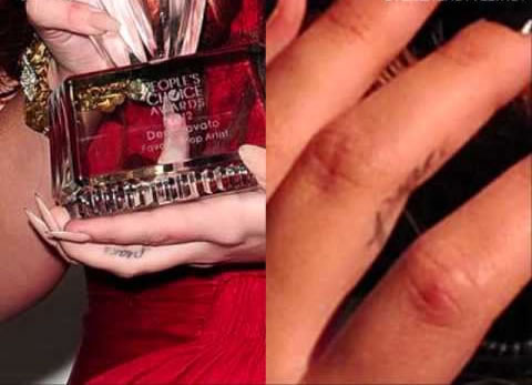 Demi Lovato finger tattoo