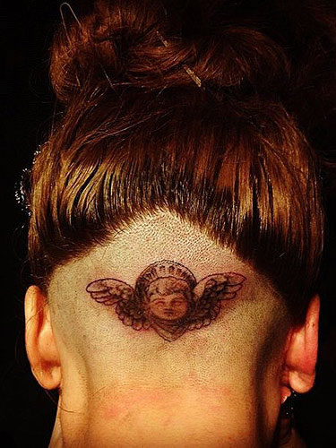 Lady Gaga shaved her head and got angel tattooed on the back