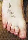 Butterfly tattoo on Britney's foot