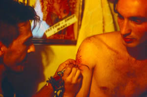 Naki tattooing Fatos.