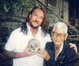 Thomas Lockhart and elderly man showing off a skull