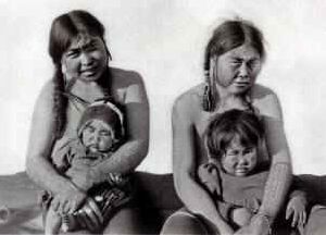 King Island women displaying iqalleq, arm tattoos, ca. 1900.