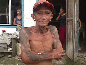 An Iban showing some traditional tattooing on the Balleh river