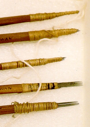 Close-up of Haida traditional hand-poking tattooing implements.