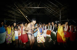 The Kayabi shaman Tuiarajup leads a Jawosi dance in the community hut.