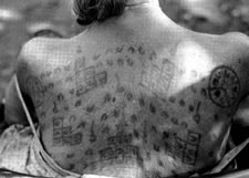 Lawae woman with protective Sanskrit letters encased in diagrams to protect her from bullets, biting animals, and other dangers from all directions. Photograph © Michael Laukien. 