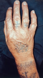 Bosnian woman's hand tattoos, 2000. Photograph ©  Michael Laukien.